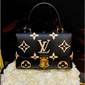 Like New LV authentic Madeline BB, with LV bag, box and dust bag.